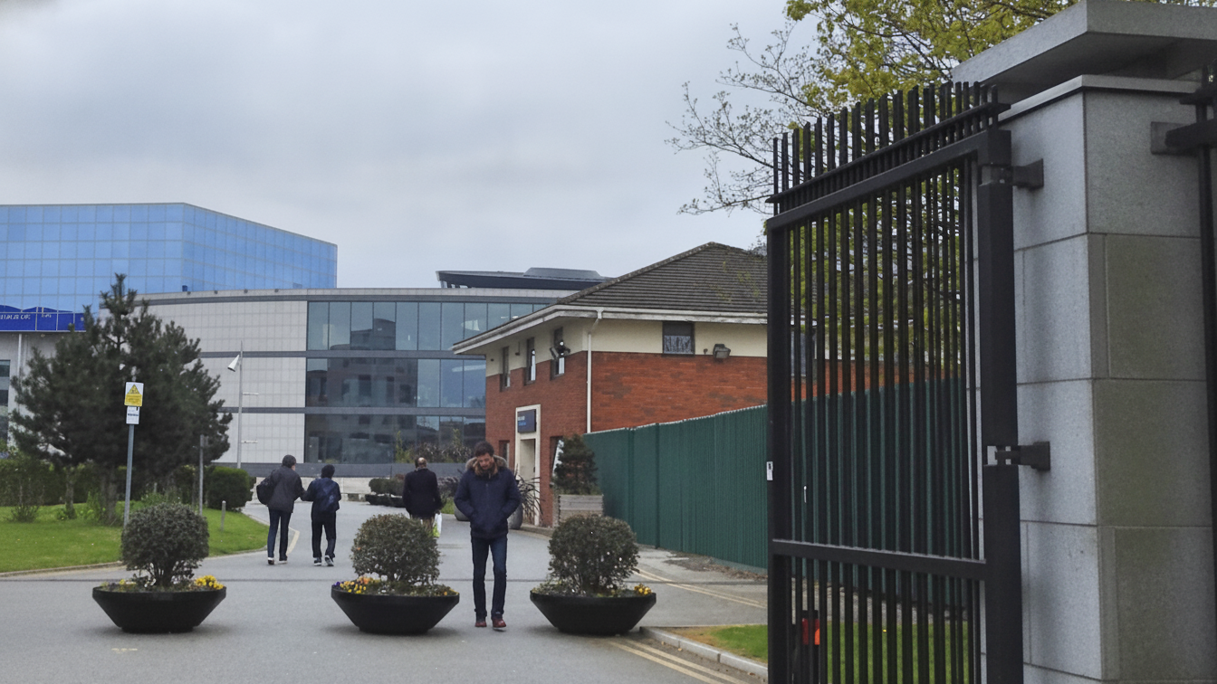 People walking at the entrance to Dublin City University's campus.